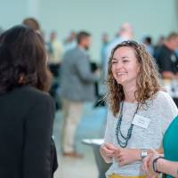 President Philomena Mantella and Paul Plotkowski talking with students